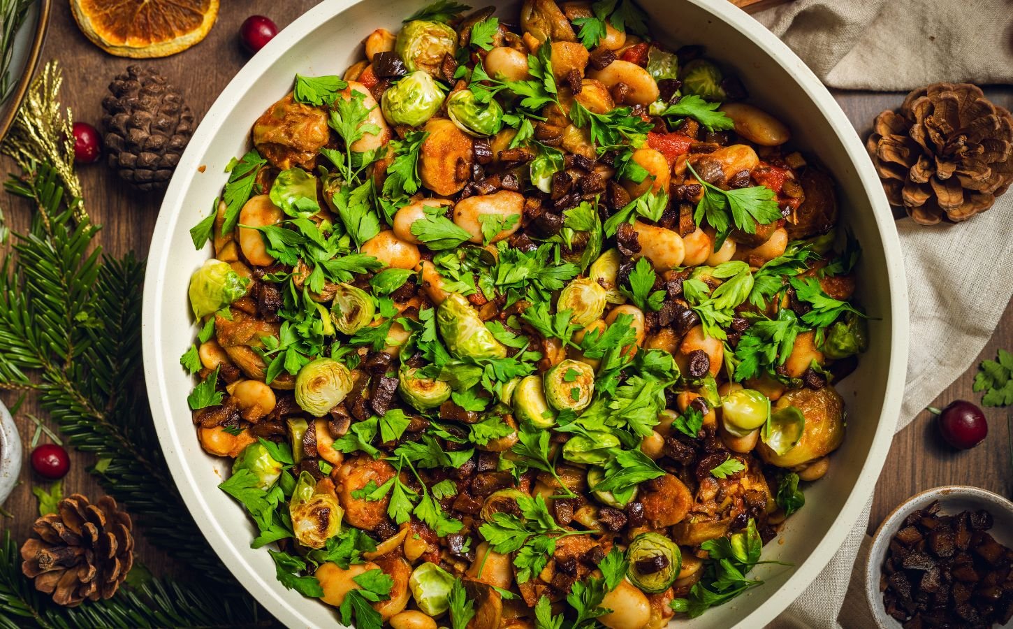 a bowl of chopped, caramelized sprouts with butter beans and chestnuts