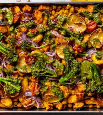 a vegan zesty chickpea traybake with cherry tomato confit