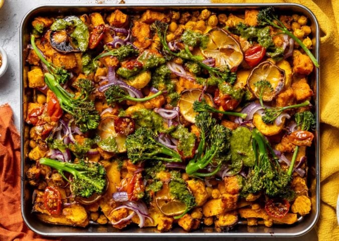 a vegan zesty chickpea traybake with cherry tomato confit