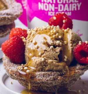 vegan churro ice cream cups filled with dairy-free ice cream and raspberries