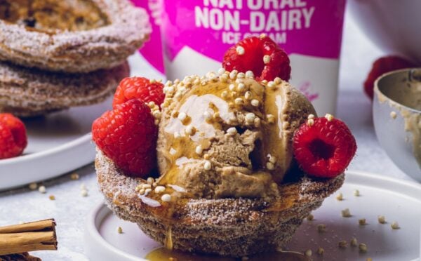 vegan churro ice cream cups filled with dairy-free ice cream and raspberries