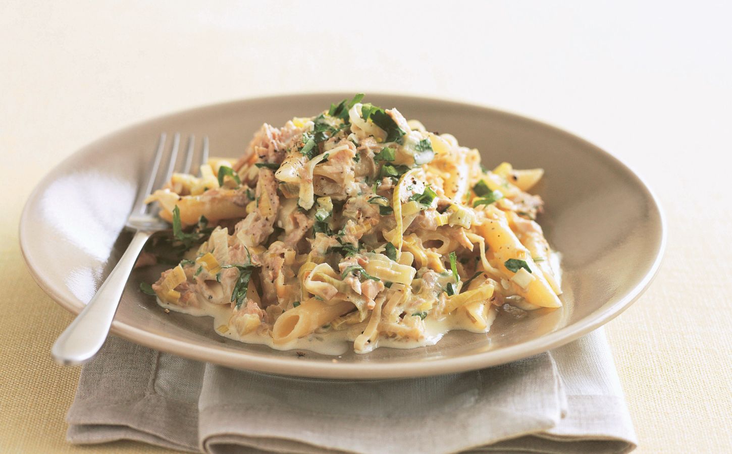 a bowl of vegan creamy tuna and leek pasta