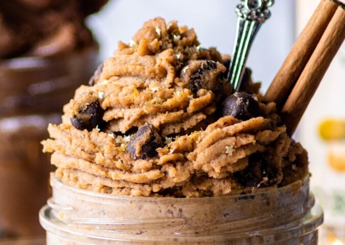 a jar of piped vegan gingerbread cookie dough made with chickpeas and almond butter