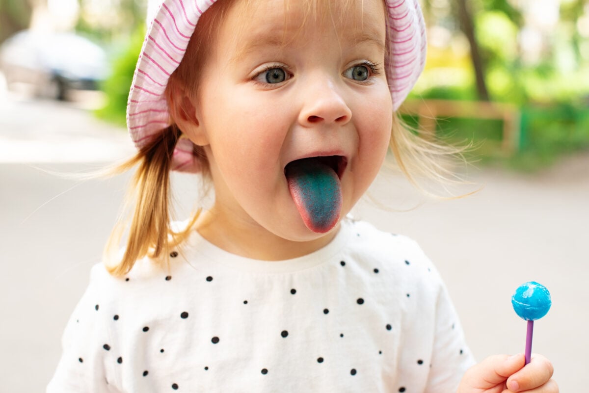 girl with blue tongue from lollipop