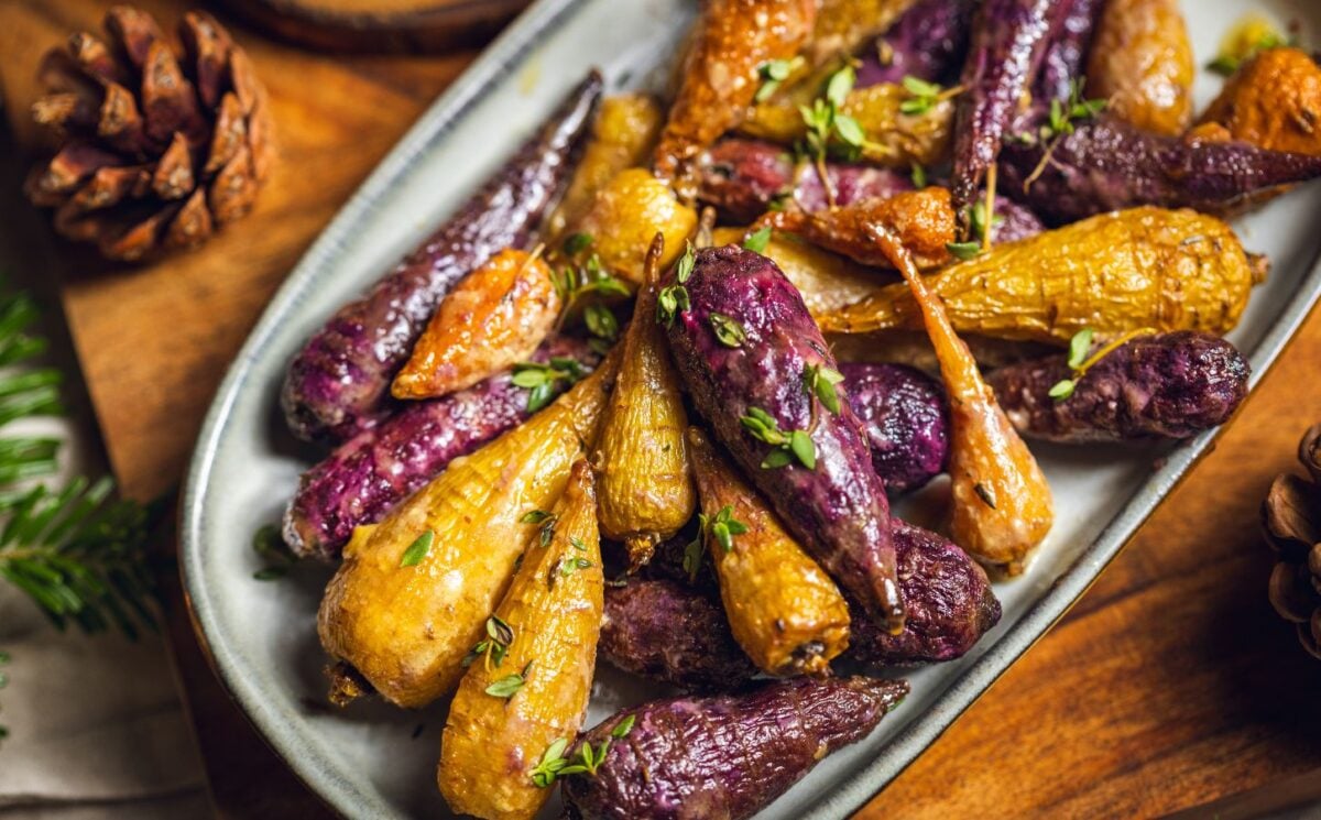 a plate of glazed rainbow carrots roasted in agave, olive oil, herbs, and apple cider vinegar