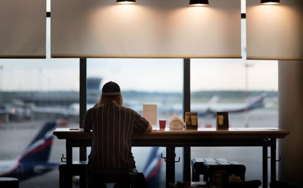 A person eating food at an airport