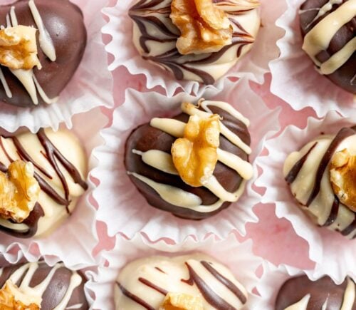 a picture of rows of heart-shaped chocolate truffles that are vegan