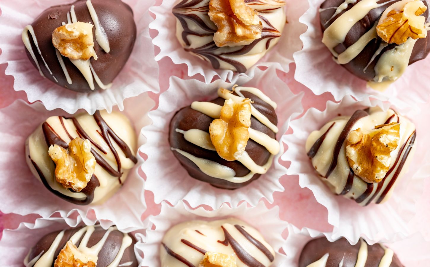 a picture of rows of heart-shaped chocolate truffles that are vegan