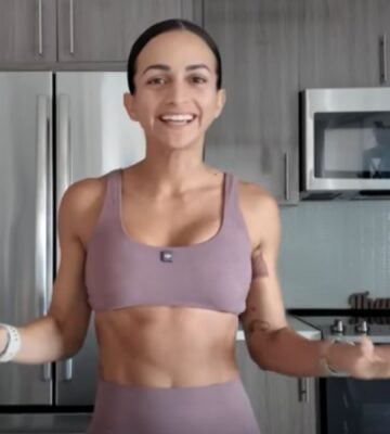 Vegan athlete Natalie Matthews standing in her kitchen