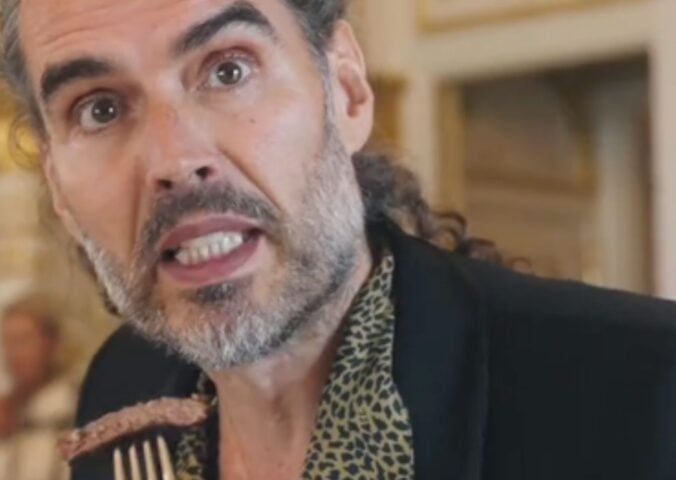 Former vegan Russell Brand eating a steak