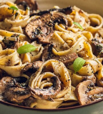 A plate of mushroom and sage pasta cooked to a dairy-free and vegan recipe