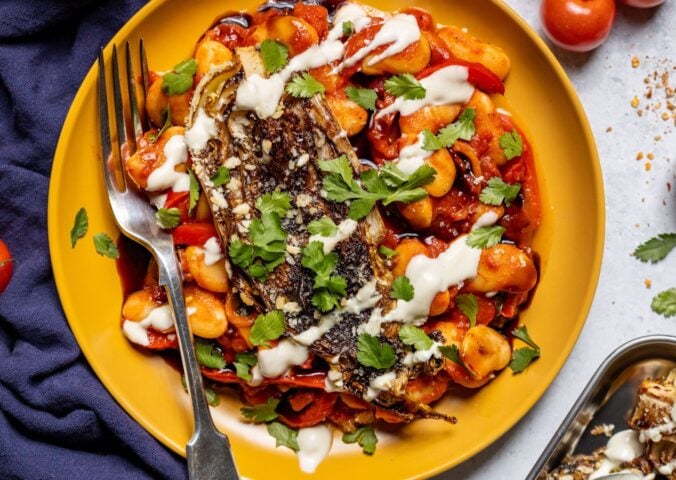 a plate of seared balsamic cabbage on harissa butter beans with coconut yogurt dressing