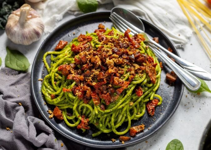 a bowl of seasonal super green spaghetti with chestnuts and sun-dried tomatoes