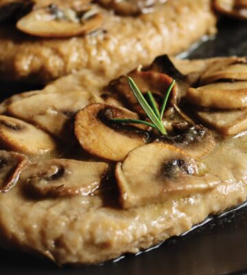 a close up of seitan fillets with mushroom wine sauce