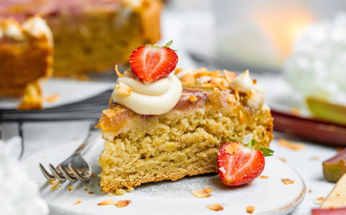 a slice of upside-down rhubarb coconut cake close up