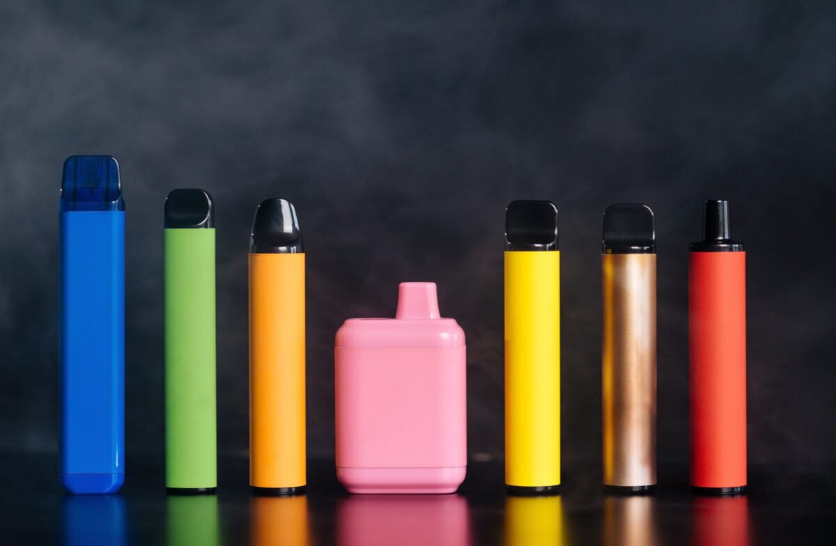 A line of colorful disposable vapes