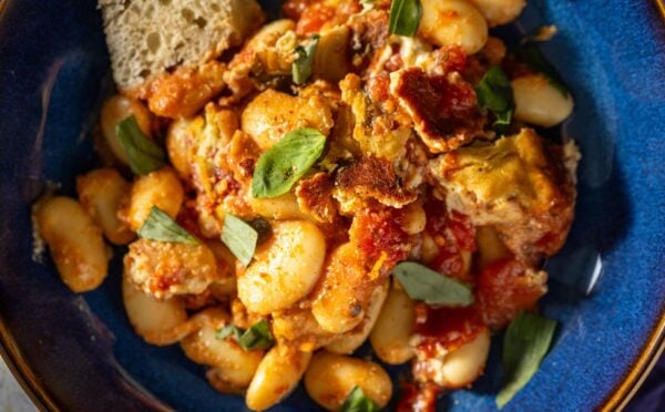 A high protein vegan bean bake on a blue plate