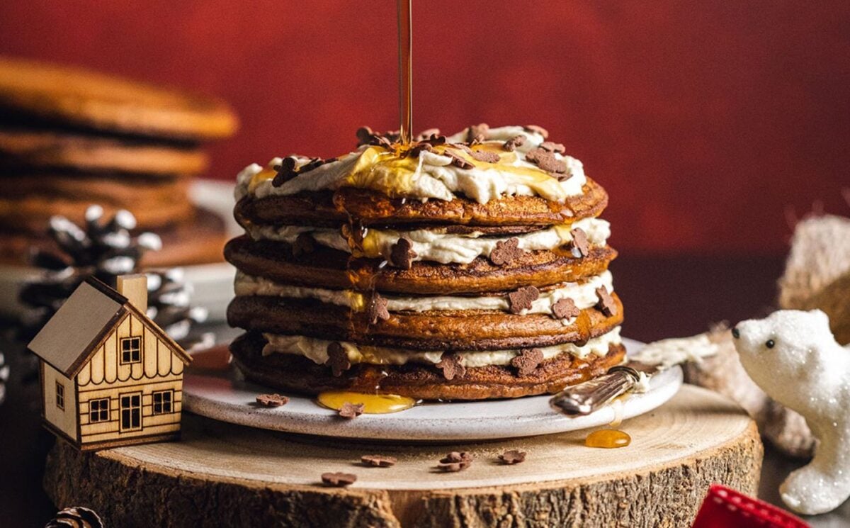 a stack pf vegan gingerbread pancakes with coconut yogurt layers