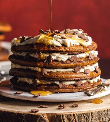 a stack pf vegan gingerbread pancakes with coconut yogurt layers