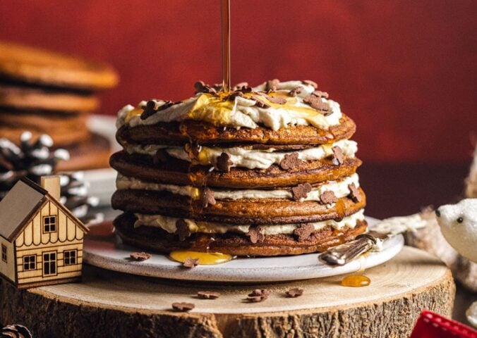 a stack pf vegan gingerbread pancakes with coconut yogurt layers