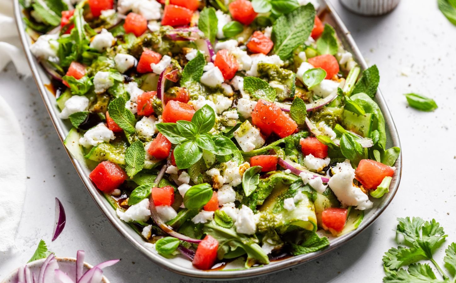 a vegan watermelon and feta salad made with cucumber and rocket