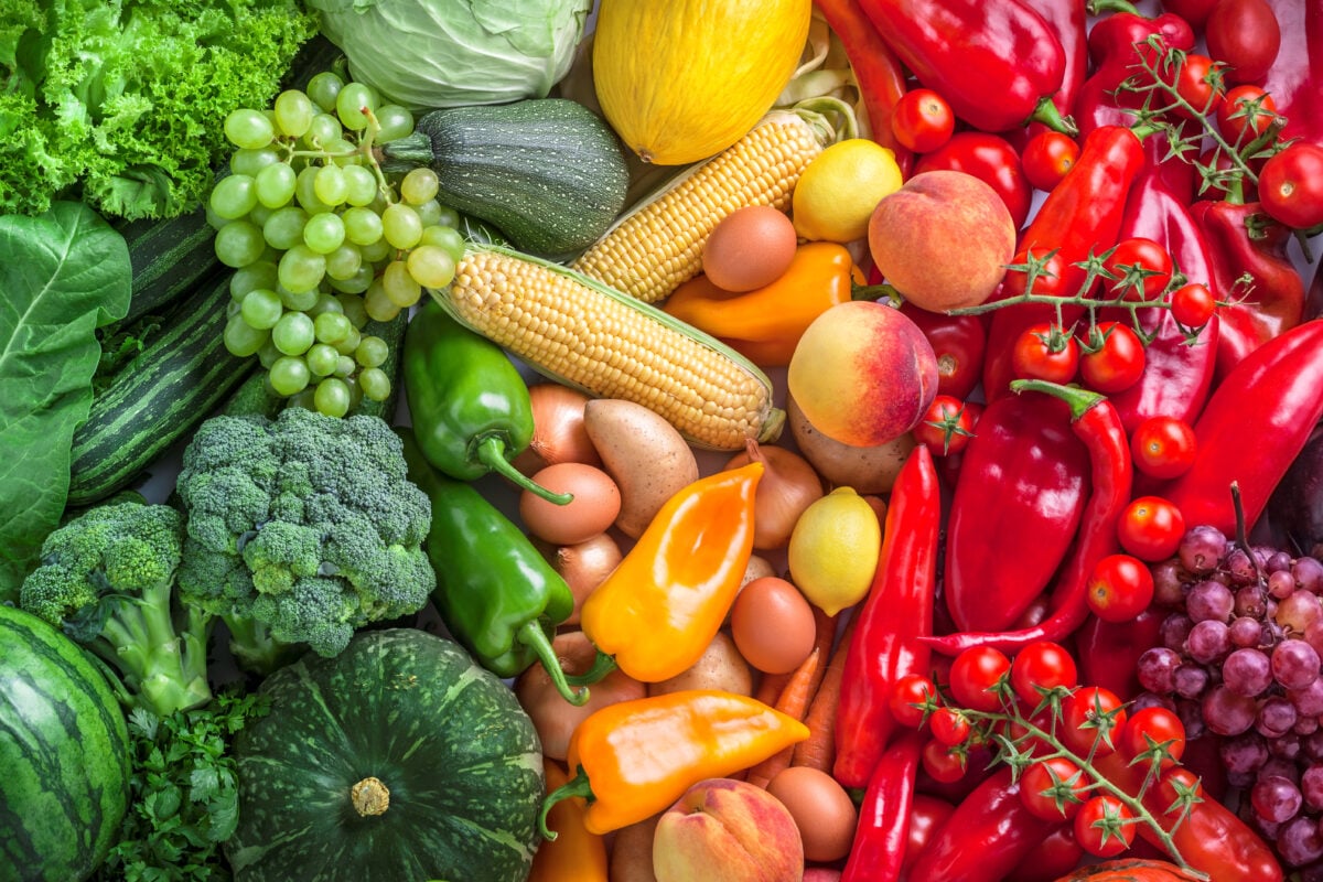 Photo shows an assortment of colorful fruits and vegetables from above