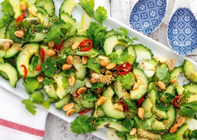 a platter of Vietnamese cucumber salad with Thai red chili and peanuts