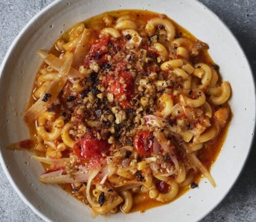 a bowl of balsamic tomato macaroni with olive pangrattata