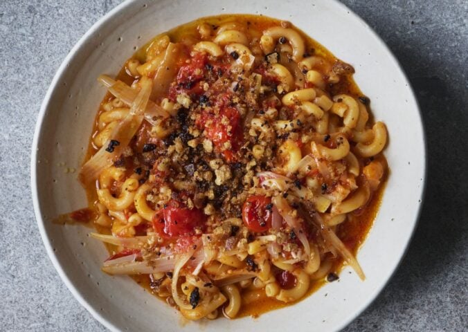 a bowl of balsamic tomato macaroni with olive pangrattata