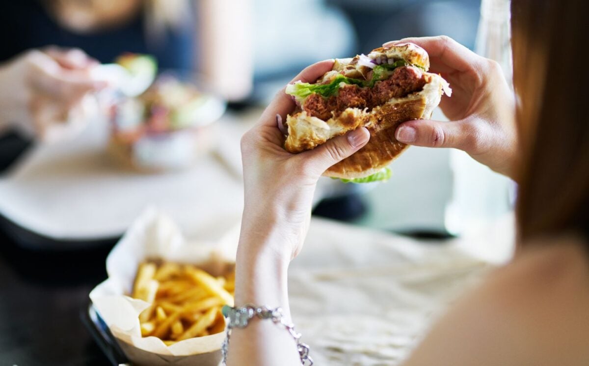 woman eating vegan burger