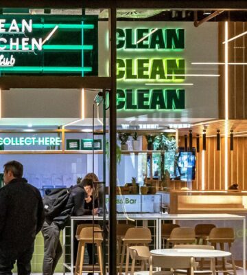 Photo shows a group of people inside Clean Kitchen Club's Battersea location