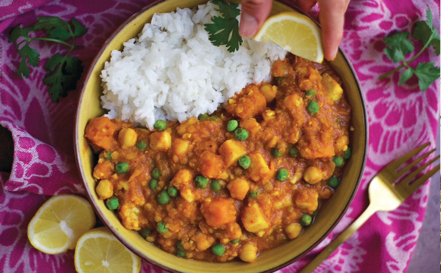 a bowl of curry spiced red lentil stew with rice