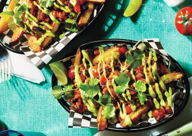 Two baskets of pulled aubergine and black bean loaded fries