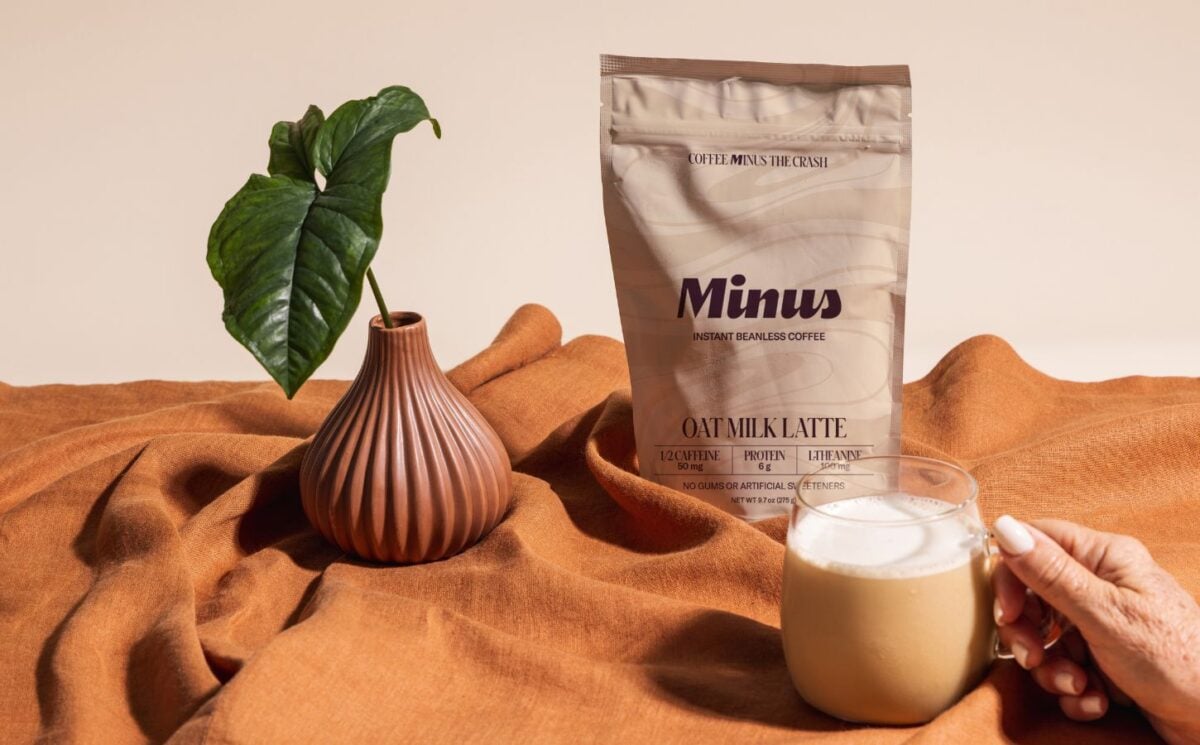 Photo shows the new Minus Instant Vanilla Oat Milk Latte in its packaging and made into a cup of coffee