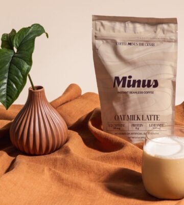 Photo shows the new Minus Instant Vanilla Oat Milk Latte in its packaging and made into a cup of coffee