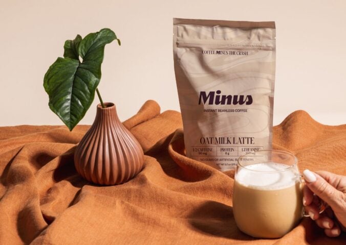 Photo shows the new Minus Instant Vanilla Oat Milk Latte in its packaging and made into a cup of coffee