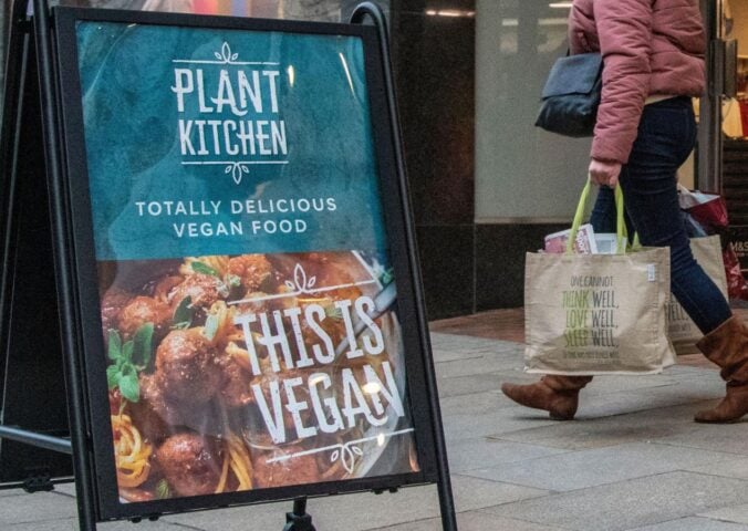 A sign for M&S Plant Kitchen, the supermarket's vegan food brand, outside a Marks and Spencer store