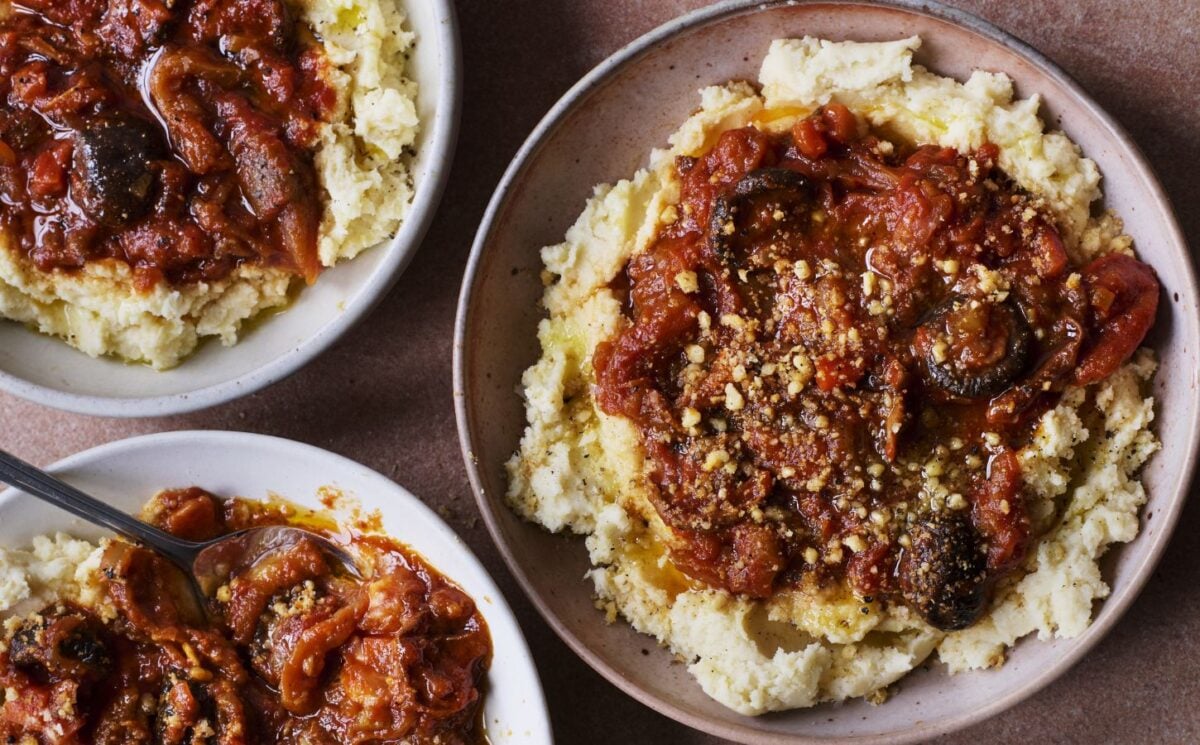 three bowls of vegan pulled aubergine ragu on top of hummus infused mash