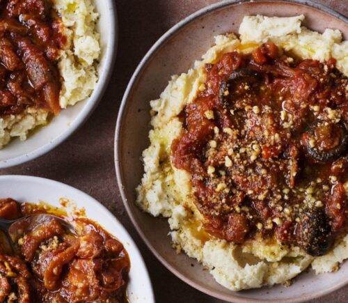 three bowls of vegan pulled aubergine ragu on top of hummus infused mash