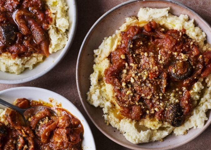 three bowls of vegan pulled aubergine ragu on top of hummus infused mash