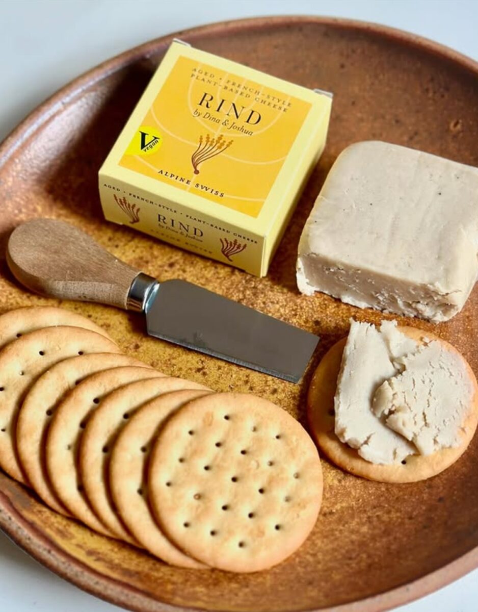 A packet of RIND vegan cheese next to some crackers