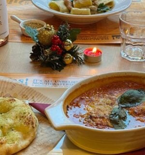 Photo shows several dishes from the vegan Italian restaurant Sora Lella on a table