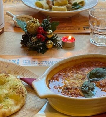 Photo shows several dishes from the vegan Italian restaurant Sora Lella on a table