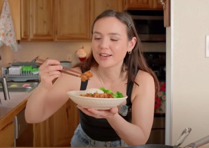 Plant-based recipe developer Sarah Sullivan eating one of her vegan tofu recipes