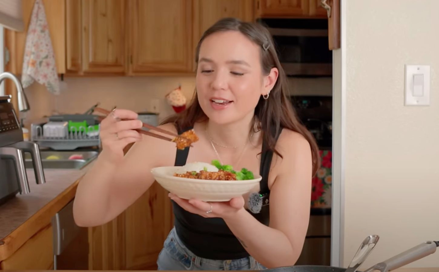 Plant-based recipe developer Sarah Sullivan eating one of her vegan tofu recipes