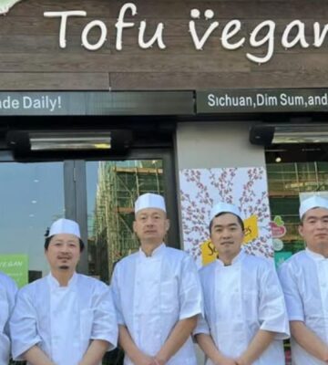 Tofu Vegan chefs standing outside one of the London restaurants