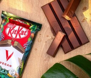 A vegan KitKat in its packaging next to the wafter bars