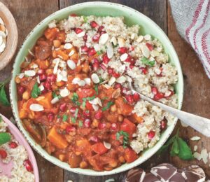 a bowl of Moroccan-inspired tagine with sweet potato, harissa, tomato, zucchini, and chickpeas