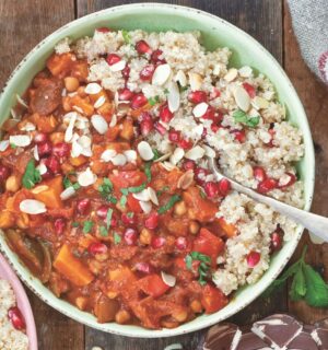 a bowl of Moroccan-inspired tagine with sweet potato, harissa, tomato, zucchini, and chickpeas