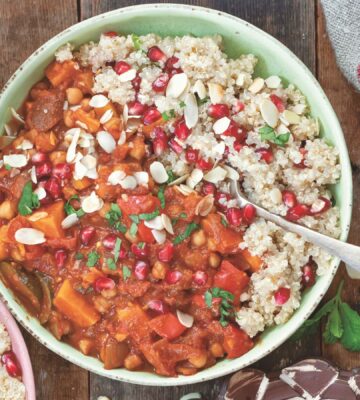 a bowl of Moroccan-inspired tagine with sweet potato, harissa, tomato, zucchini, and chickpeas